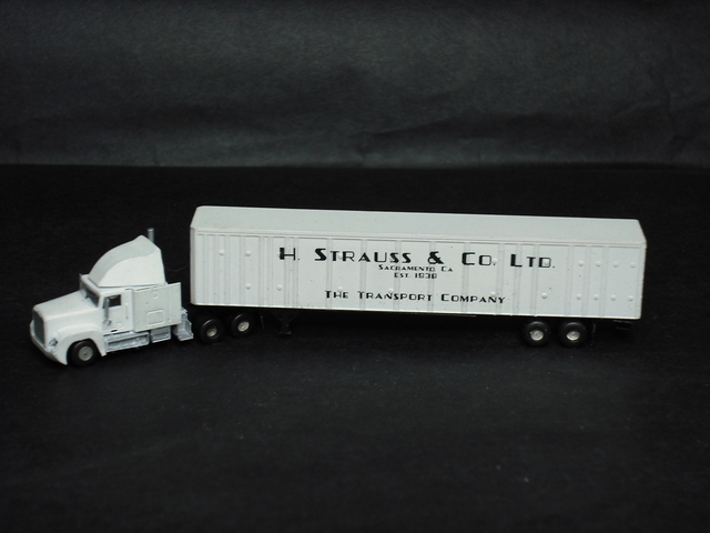 Freightliner FL120 truck and trailer