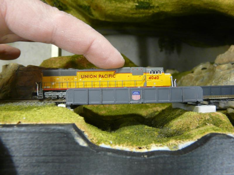 Side view of SD70 on the Walthers N scale bridge
